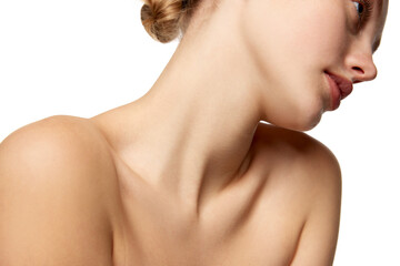 Cropped image of young beautiful woman with bare shoulders and slim long neck isolated over white studio background.