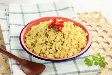 Tahu Bejek or Tahu Bubuk, Crushed Yellow Tofu Cooked with Garlic, Shallots, and Eggs