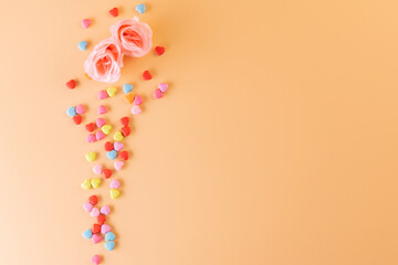 Valentines day with pink rose and small color heart on top view for valentines background
