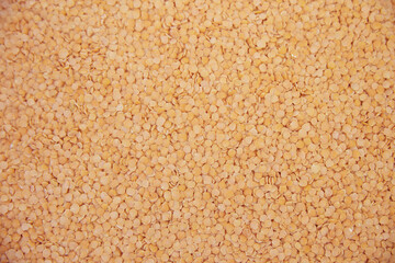Red lentils background and texture