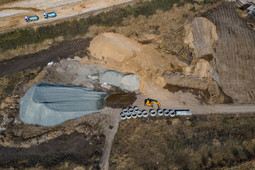 
Road construction. New section of the road. Top view of the construction of transport interchanges...