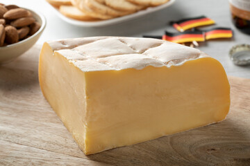  Piece of fresh Brugge Blomme, Belgian cheese, close up on a cutting board