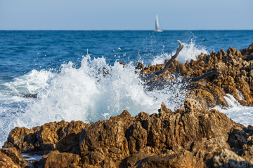 Waves crashing on rocks on  Cap d'Antibes, France