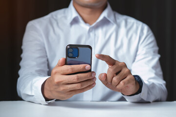 Man holding  smartphone, ideas innovation business finance  
investmen and inspiration.