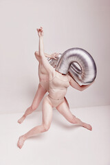 Abstract. Creative photography with two young girls posing in nude underwear over beige studio...