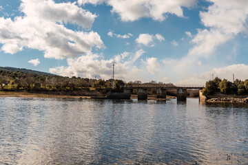 Fototapeta premium Lake with a bridge and mountains