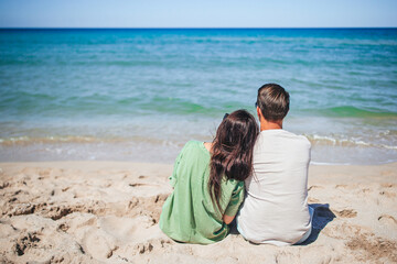 Young couple on white beach during summer vacation