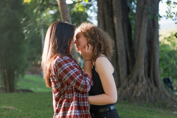 Beautiful women LGBT Lesbian Couple intimate moments. Young couple multiracial female friends. multi-ethnic female couple in love hug each other