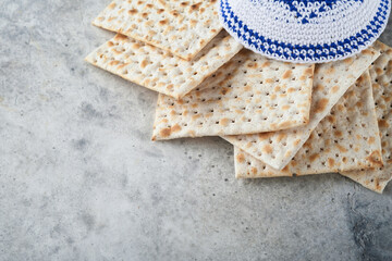 Passover celebration concept. Matzah, red kosher and walnut. Traditional ritual Jewish bread...