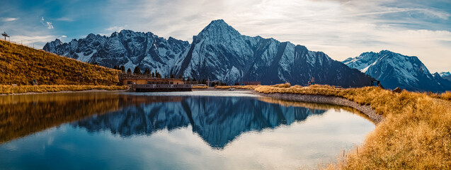 High resolution stitched panorama with reflections in a lake at the famous Ahorn summit, Mayrhofen, Zillertal valley, Tyrol, Austria