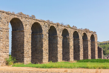 Fototapeta na wymiar Roman aqueduct at Aspendos, part of water supply ancient system. Antalya region, Turkey (Turkiye). History and archaeology background
