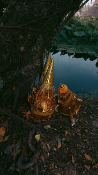 Vertical shot of a golden torma, a ceremonial sacred ritual offering in Tibetan Buddhism in Kampot, Cambodia
