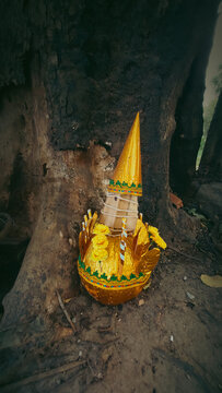 Vertical shot of a golden torma, a ceremonial sacred ritual offering in Tibetan Buddhism in Kampot, Cambodia