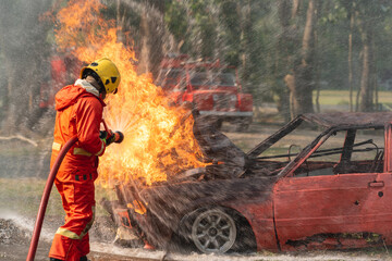 firefighter training new fireman team. Fire fighter learning car accident in fire under emergency...