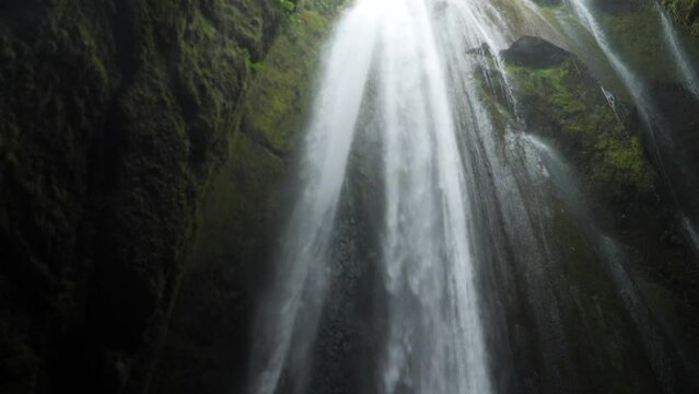 Powerful Gljufrabui or Gljufurarfoss hidden waterfall inside the cave near Seljalandsfoss in Iceland. High quality 4k footage