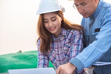 Engineers coworker discuss construction projects in workplace construction site. group of technician architect planning with blueprint and construction tools