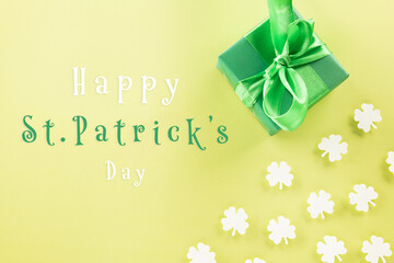 Happy St Patrick's Day decoration background concept. Top view gift box green clover leaves,...