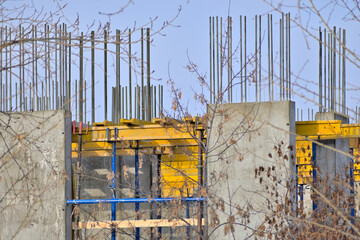 The foundation of a multi-storey residential building under construction on a winter day