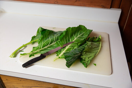 collard greens on cutting board