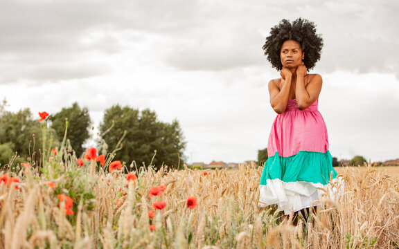 Rural Fashion. A carefree moment from a beautiful free spirited young female model enjoying nature. From a series of related images.