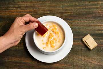 Typical Colombian food - Paisa corn mazamorra with sweet guava paste