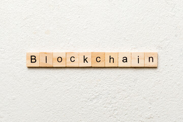 BLOCKCHAIN word written on wood block. BLOCKCHAIN text on table, concept