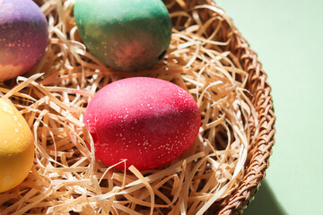 Colorful easter eggs in an easter nest