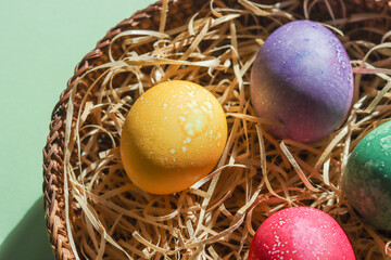 Colorful easter eggs in an easter nest