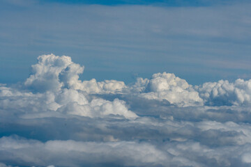 Naklejka na ściany i meble White clouds and blue sky in this aerial photograph of clouds