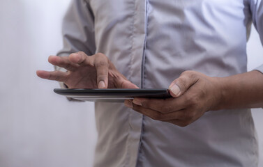 Business man using smartphone mobile on blurred background