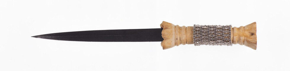 ancient sword with bone hilt on white background