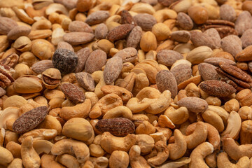 A group of almonds, pistachios, walnuts, macadamia, cashews.