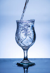 The image of pouring drinking water, into a glass,