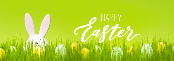 Bunch of eggs with dots on green background. Cute decor on a meadow. Greeting card with wishes....