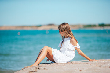 Fototapeta na wymiar Beautiful teen girl on the beach during summer vacation 