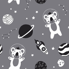 Seamless monochrome childish pattern with astronaut koala, planet, stars and constellation. Creative scandinavian kids texture for fabric, wrapping, textile, wallpaper, apparel.