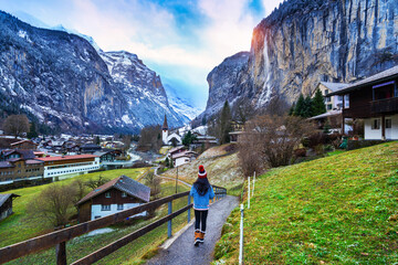 Fototapeta na wymiar Tourist visiting village of Lauterbrunnen in the Bernese Oberland, Switzerland.