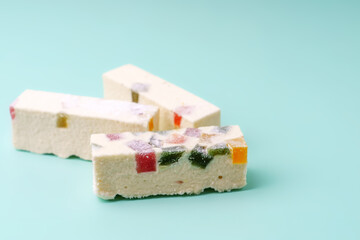 White pastille with multi-colored marmalade and candied fruits inside