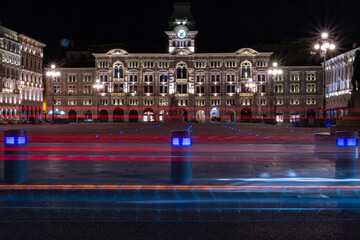 Piazza Unità d'Italia in Trieste, Italy. Perspective at night with lights of cars overlooking the square