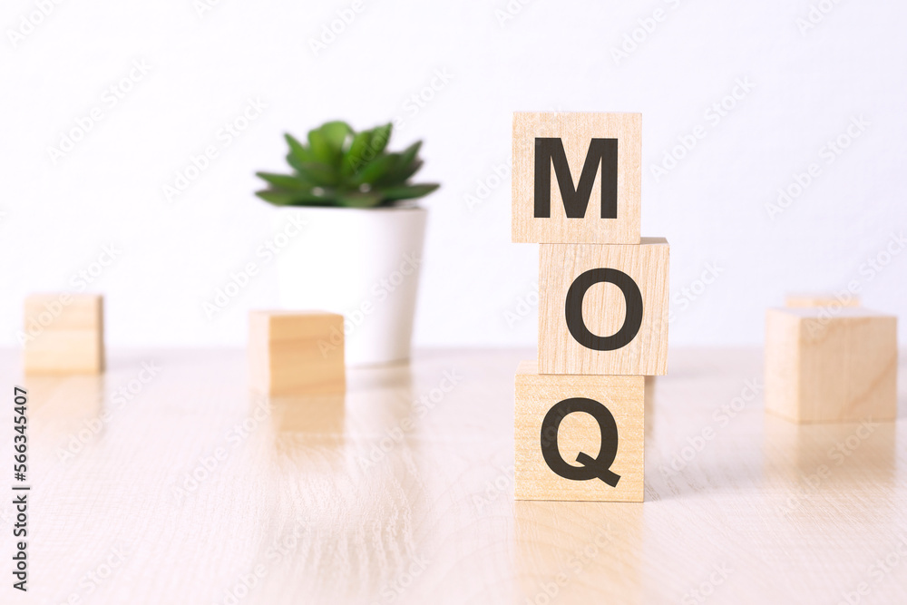 Poster moq - minimum order quantity - text on wooden cubes on a white background