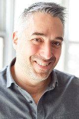 Mature Men on studio white window