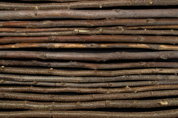 Rows of wooden branches as a background for the image