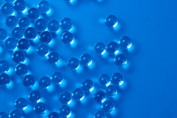 Glass balls on a blue background as a background for the image