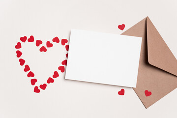 Blank Valentines Day greeting card mockup with red hearts and envelope