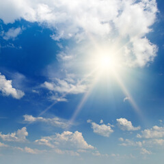 Naklejka na ściany i meble Blue sky , sun and beautiful clouds.