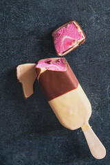 Close up view of strawberry's ice cream on dark background