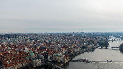 Obraz premium Aerial view of River and buildings in Old Town of Prague, Czech Republic. Drone photo high angle view of City