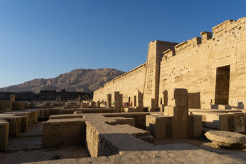 Exterior of the temple of Ramses III, many ruins of what was before the temple.