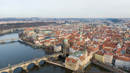 Naklejka na ściany i meble Aerial view of River and buildings in Old Town of Prague, Czech Republic. Drone photo high angle view of City
