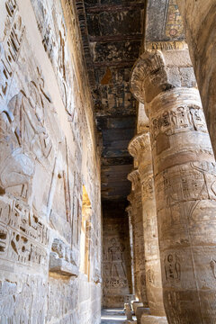 Interior of the temple of Ramses III, full of columns with drawings and hieroglyphs